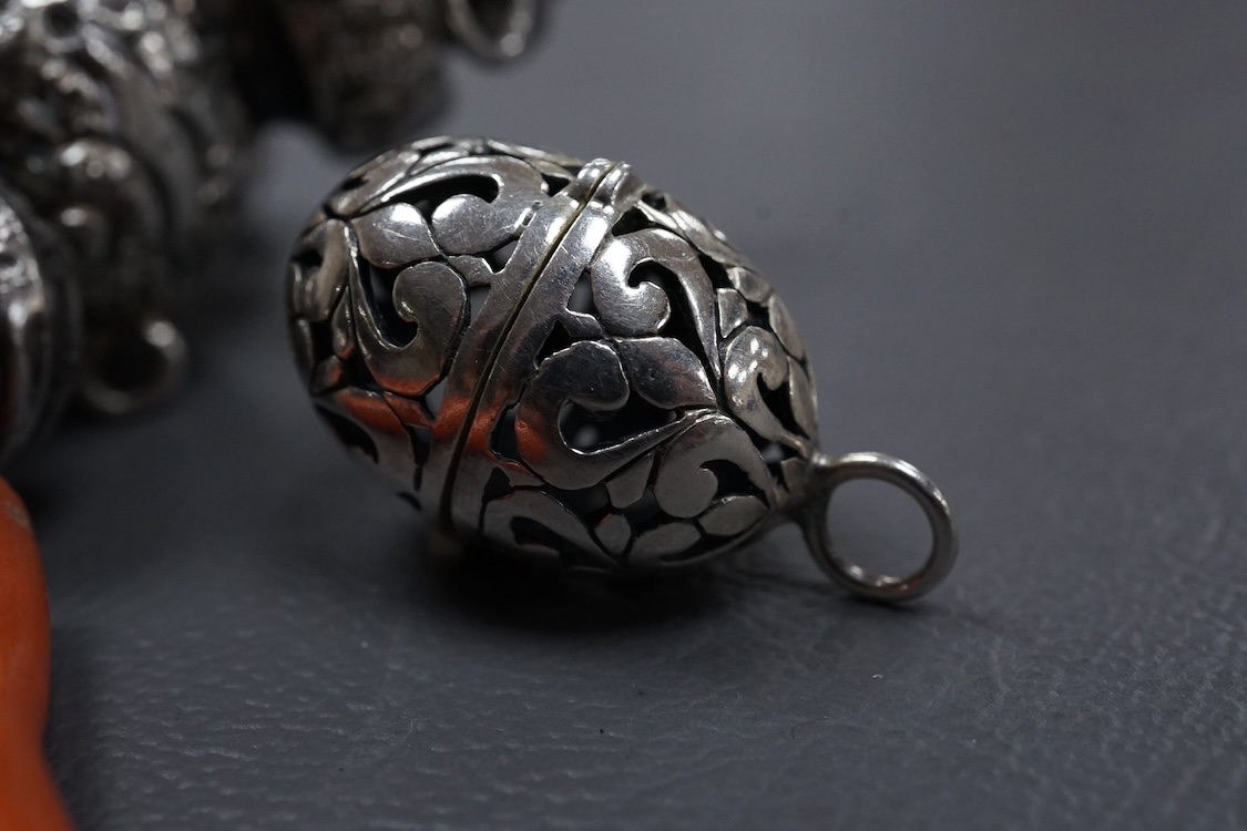 A late Victorian silver child's rattle, with four (ex five) bells and damaged coral teether, 	Colen Hewer Cheshire, Birmingham, 1890, 78mm without the coral.